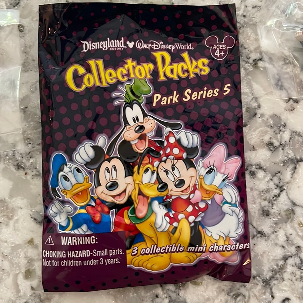 3 disney character collectibles (Woody, Animal Kingdom tree and evil queen)